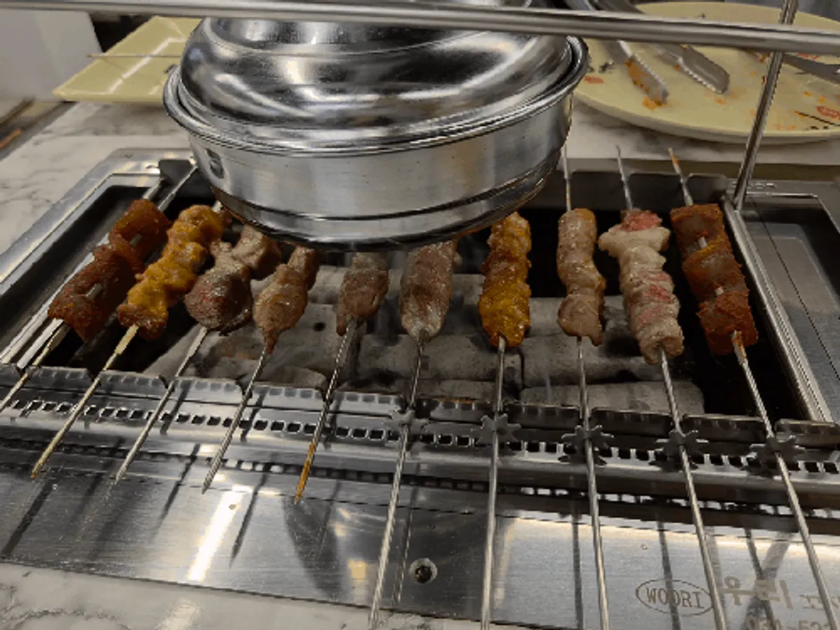 Skewers threaded onto the lamb skewer grill