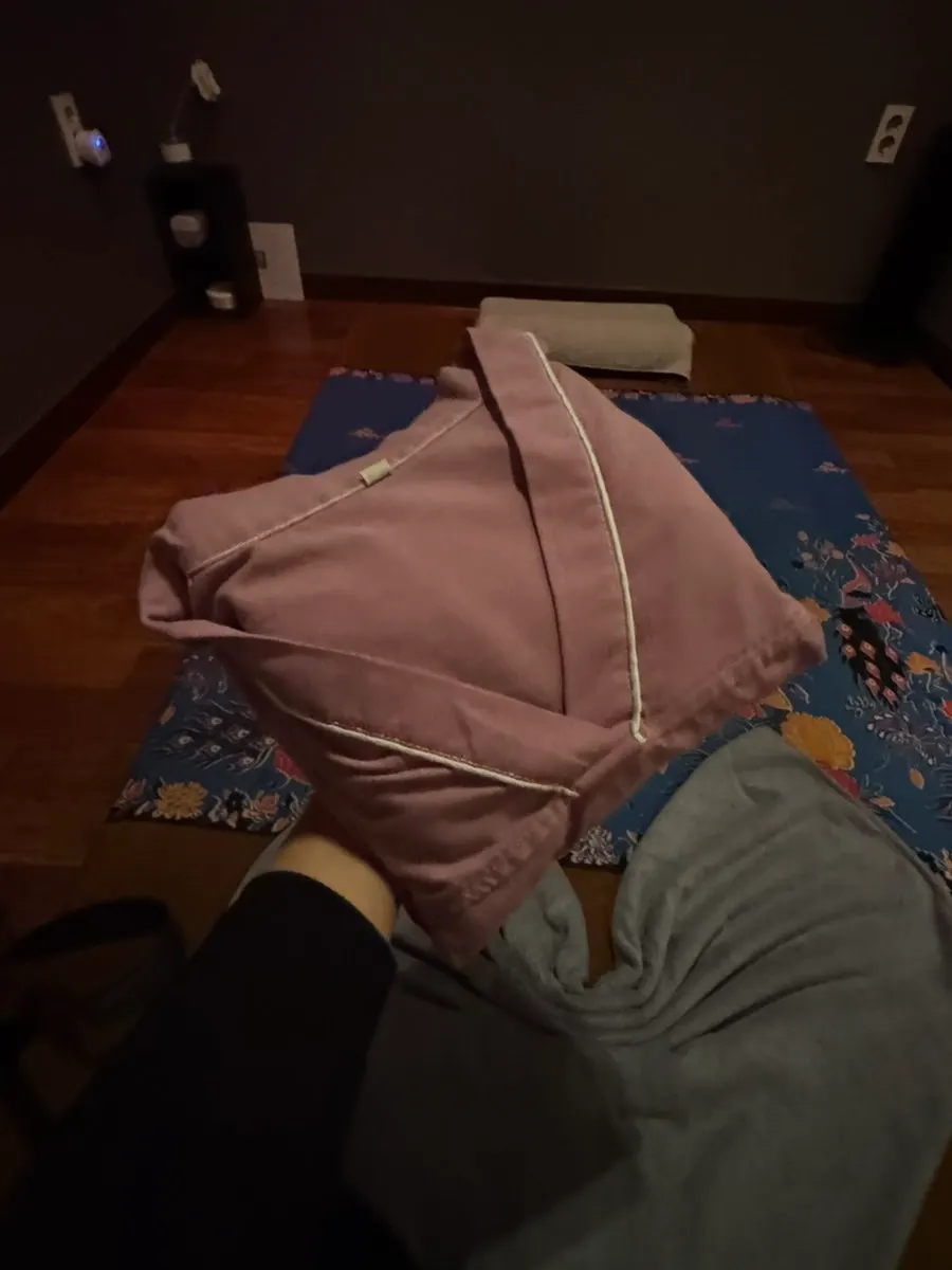 Changing clothes before a full-body treatment