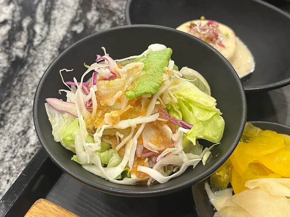 Tofu salad topped with white sauce