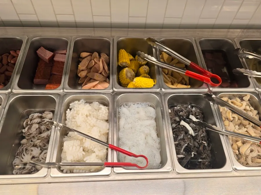Hotpot ingredients brought to the table on a plate