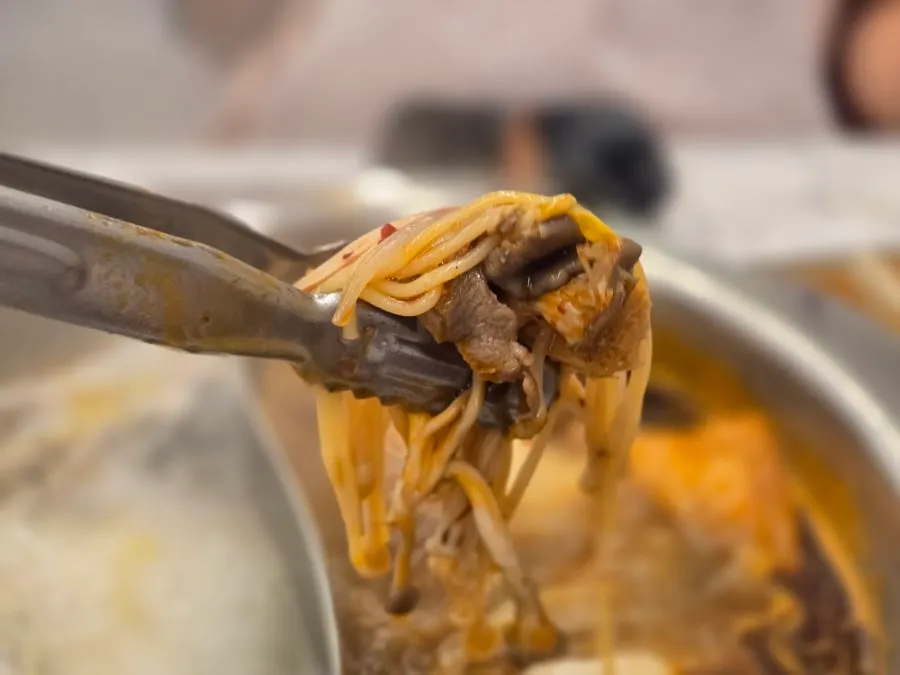 Half-and-half hotpot simmering with ingredients
