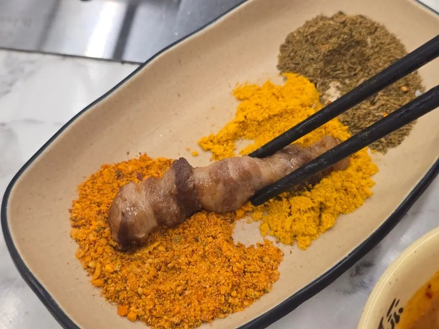 A plate of fully grilled lamb skewers
