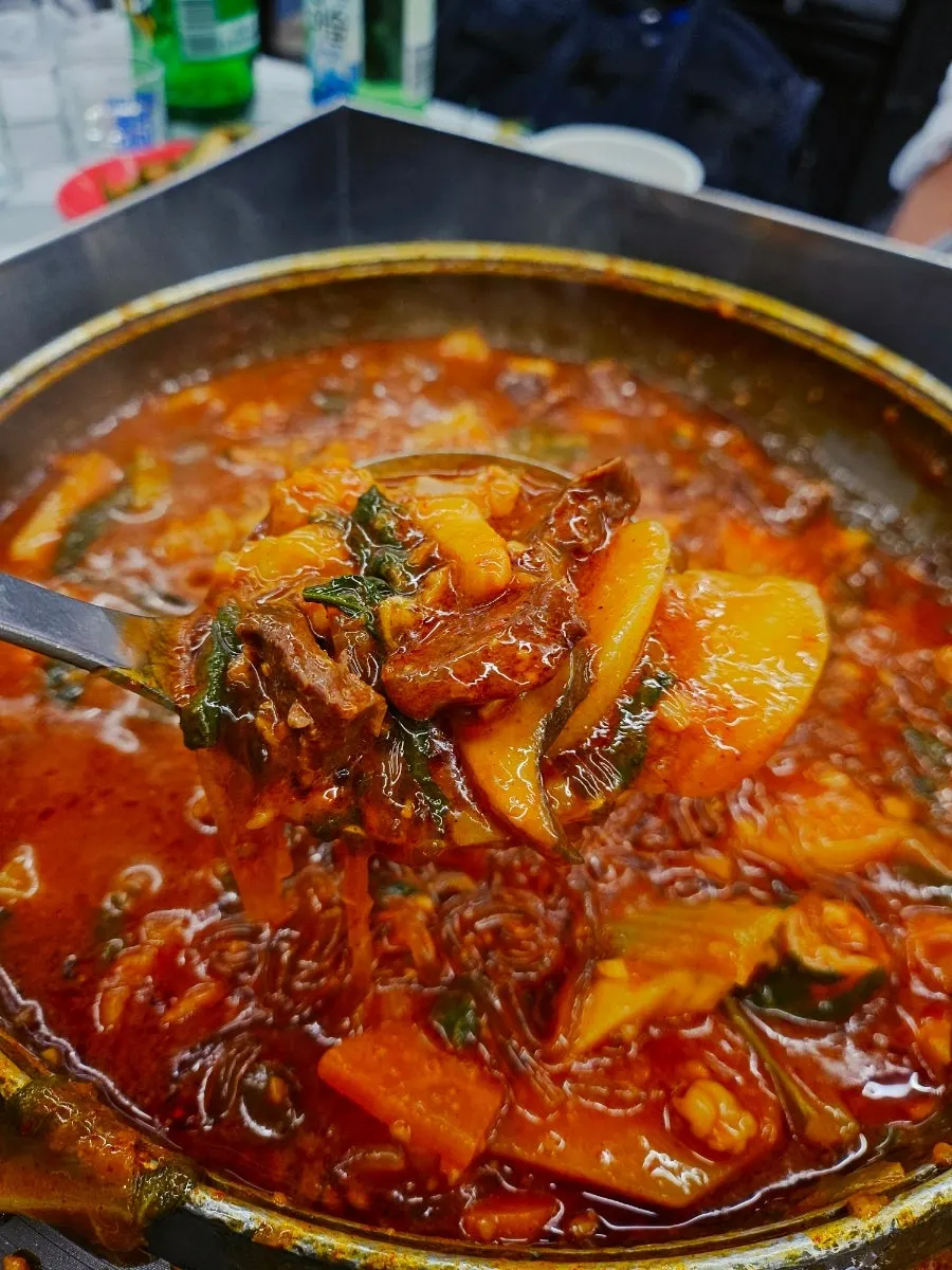 Vegetables and noodles in the gopchang hotpot before cooking