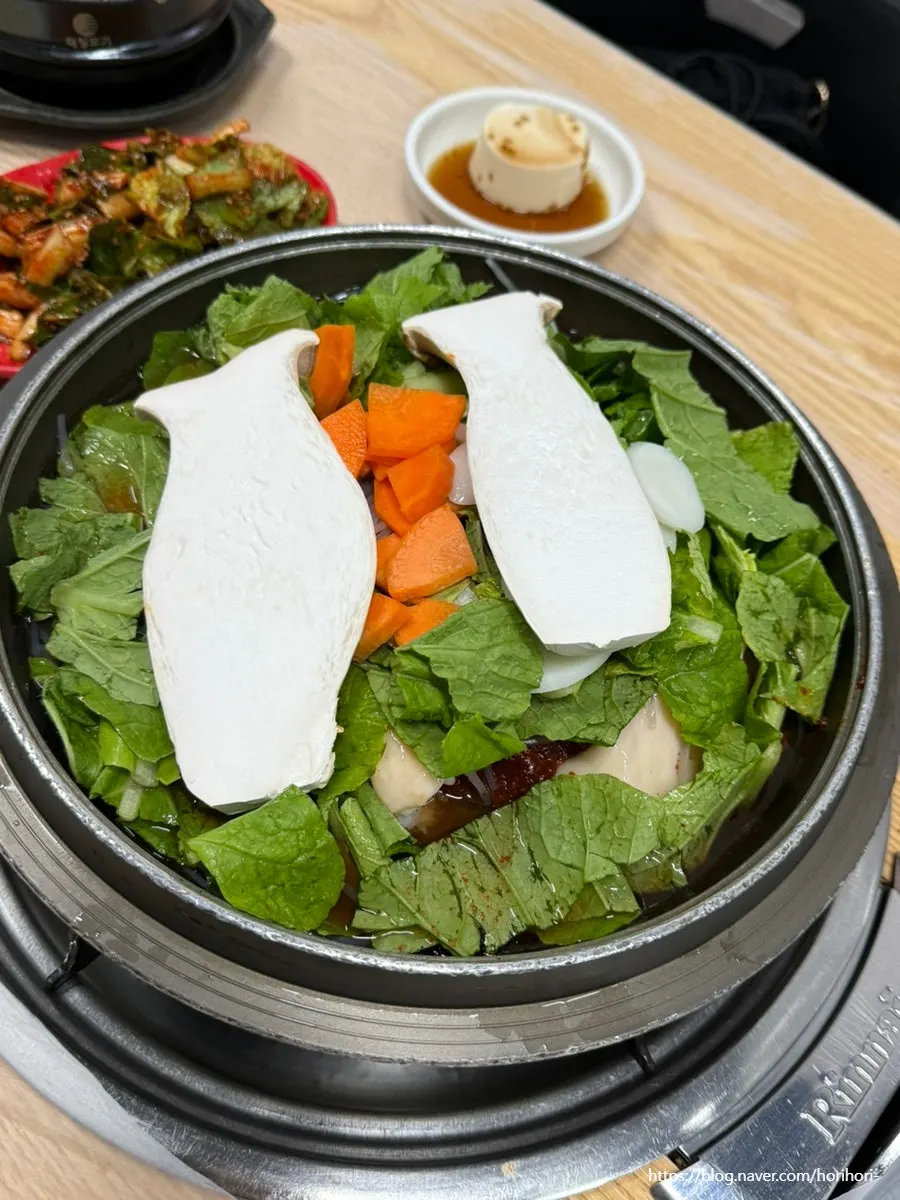Gopchang hotpot with a glass of soju