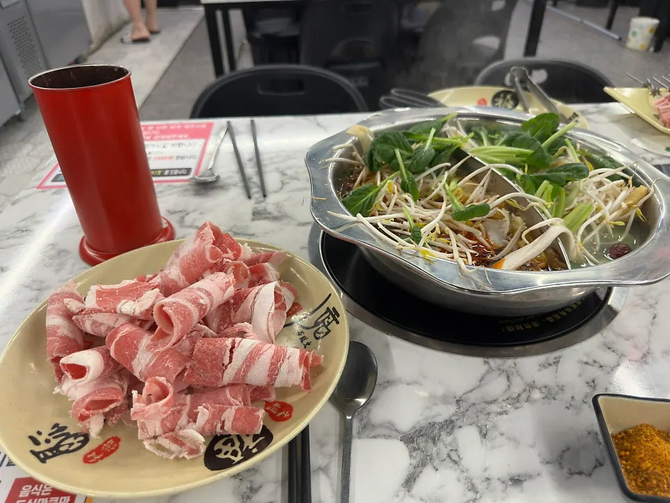 Meat cooking in boiling hotpot broth