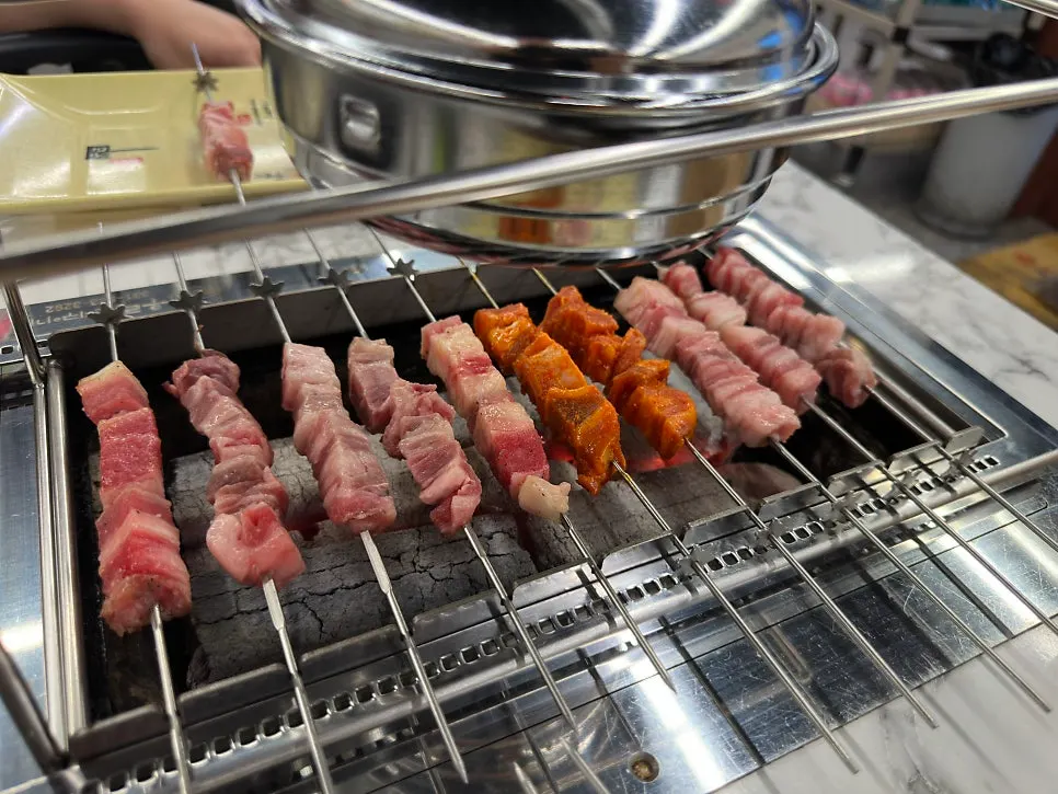 Table set with both lamb skewers and hotpot