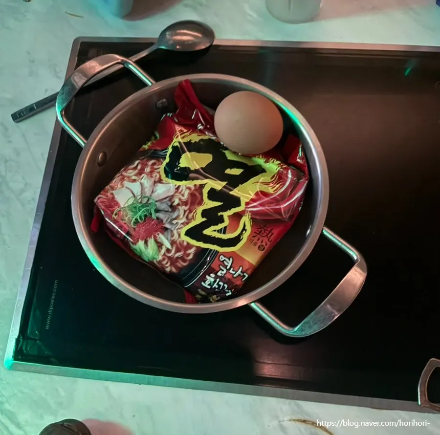 Hot ramyeon setup served with an egg
