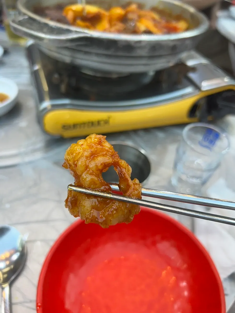 Sweetly seasoned gopchang eaten with a bowl of rice