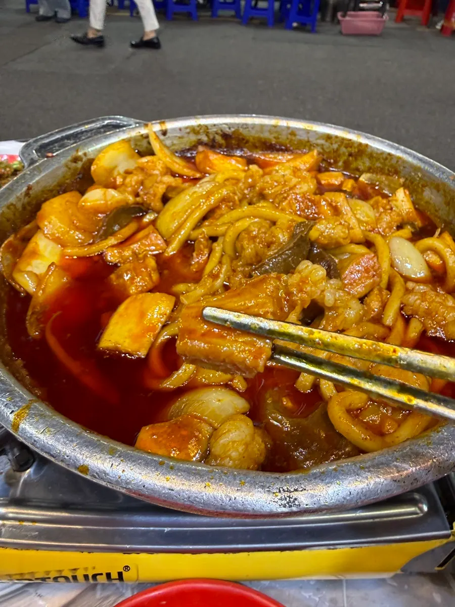 A well-cooked piece of seasoned tripe ready to eat