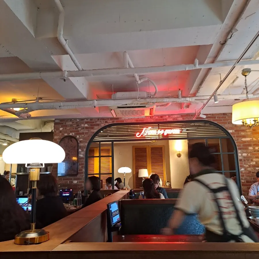 A chef hand-pleating dim sum in the 1st-floor open kitchen