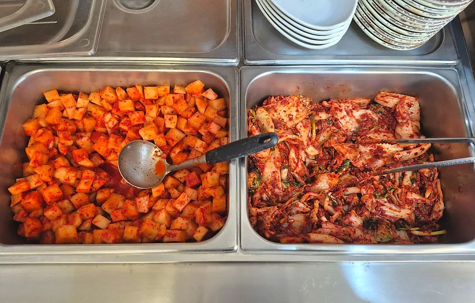 Kimchi and side dishes at the self-serve bar