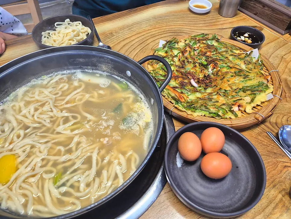 Table set with mixed clam kalguksu for two and pajeon