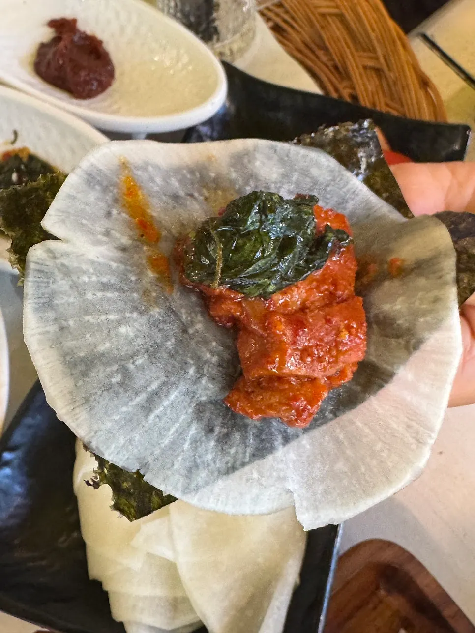 A spoonful of rice mixed with the sauce