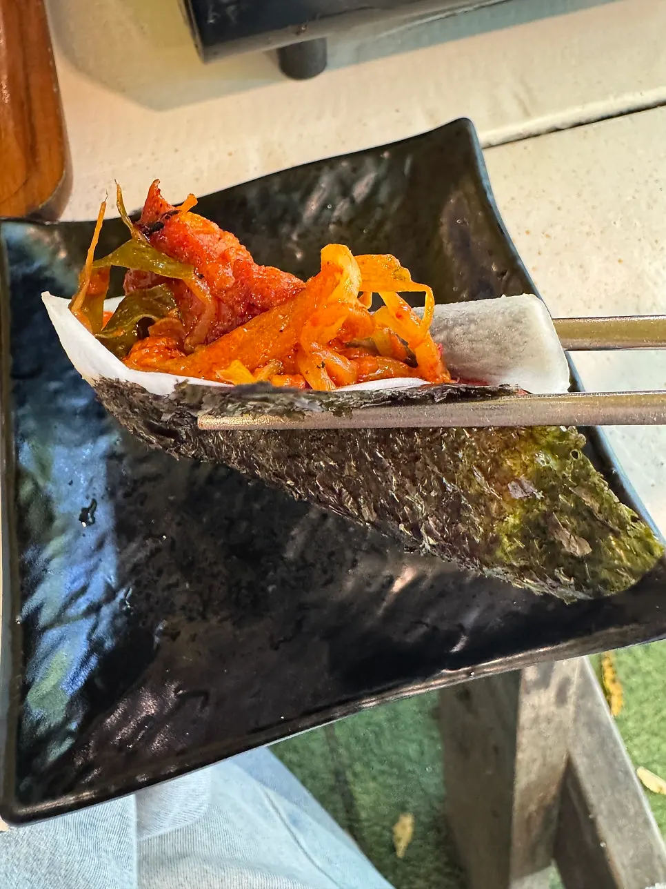 A wrap combining several ingredients with the pork belly