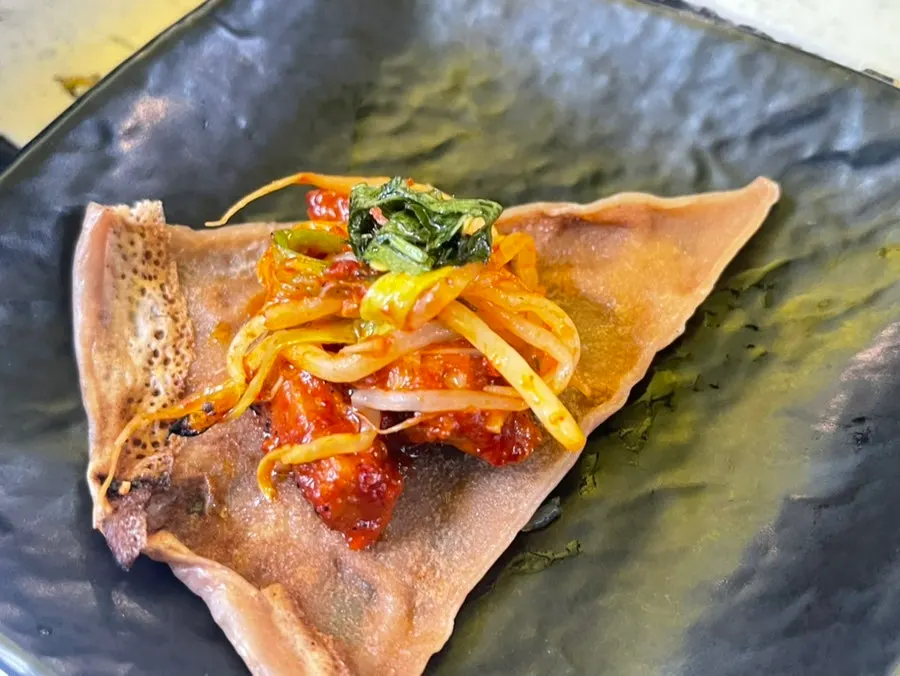 Tomato-jang pork belly topped with perilla leaf oil-jang