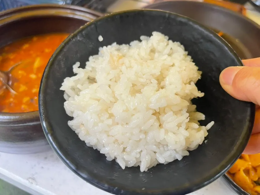 House-made noodles lifted from the tomato-jang kalguksu