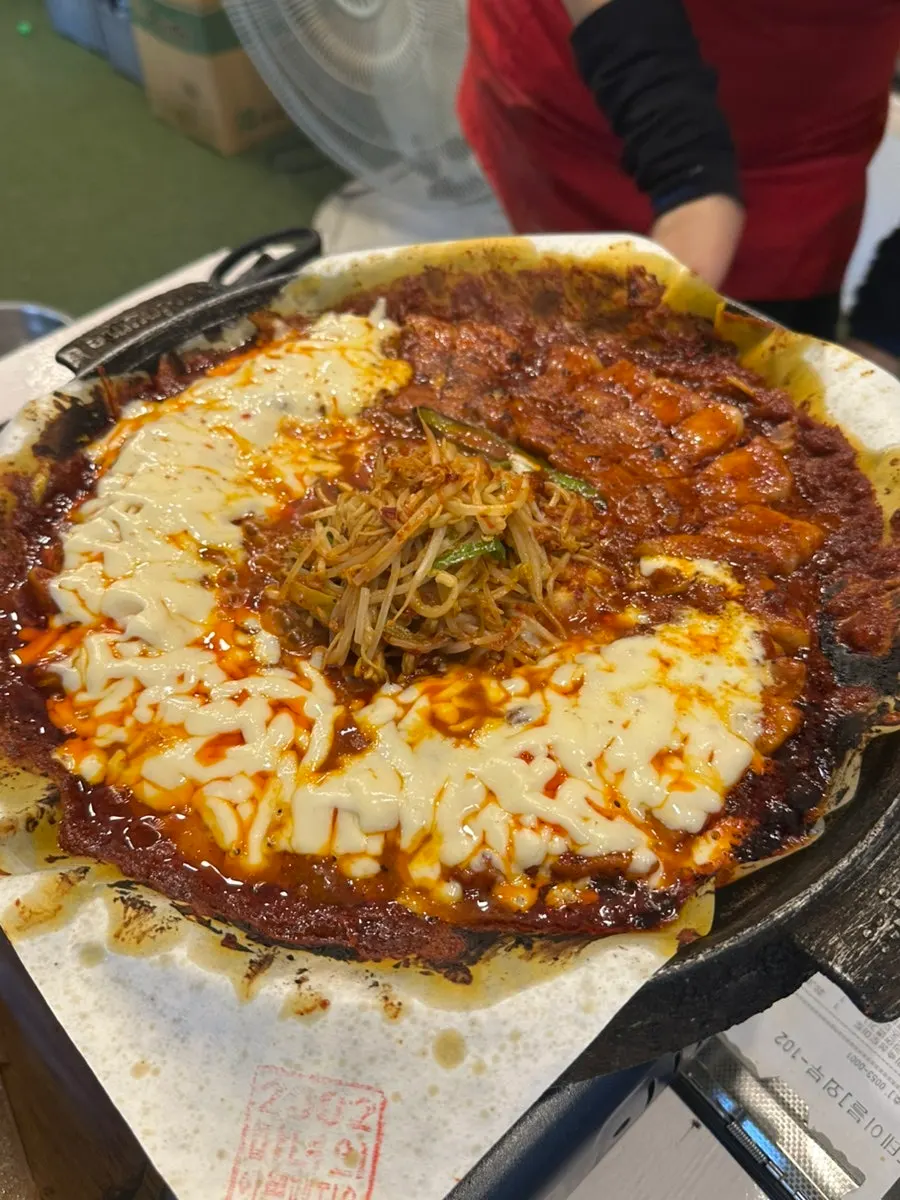 Cheese piled generously on top of the pork belly