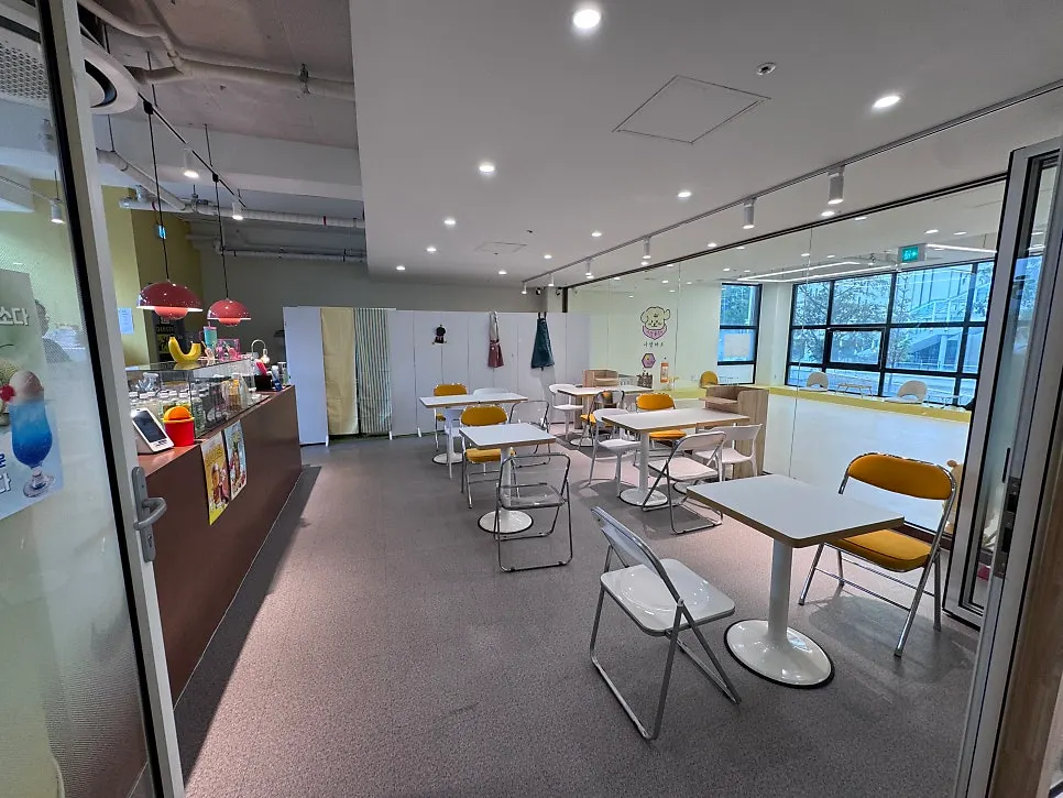 White and yellow toned café seating area