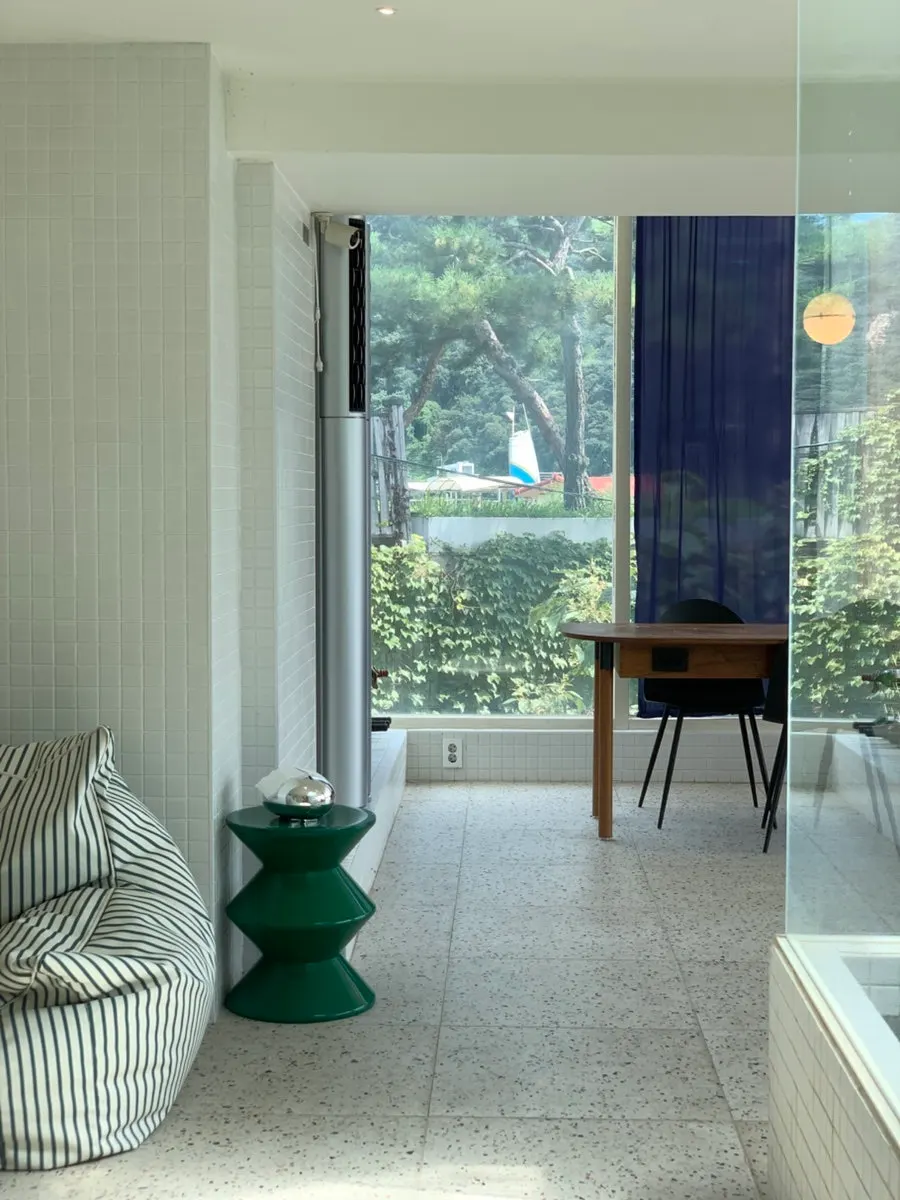 Bright annex seating in front of the floor-to-ceiling window