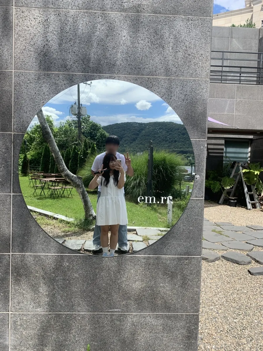 A couple photo taken at the mirror photo zone