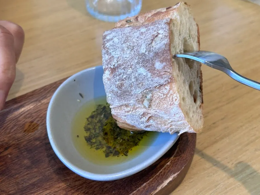 Bread before the meal and olive oil