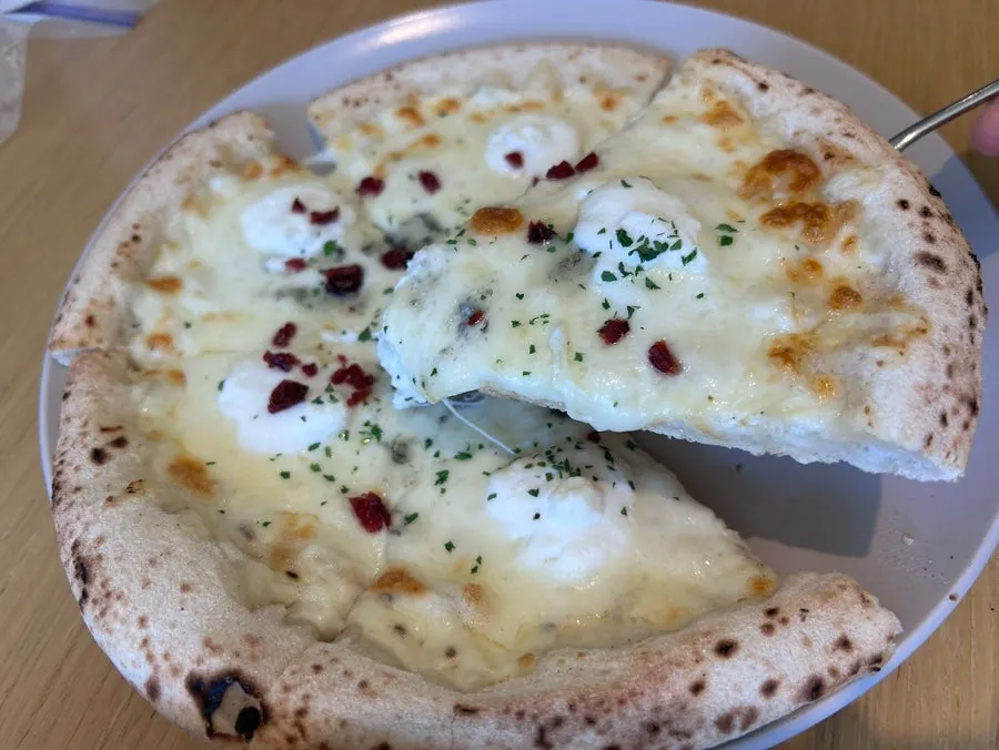 Cheese pizza served with honey