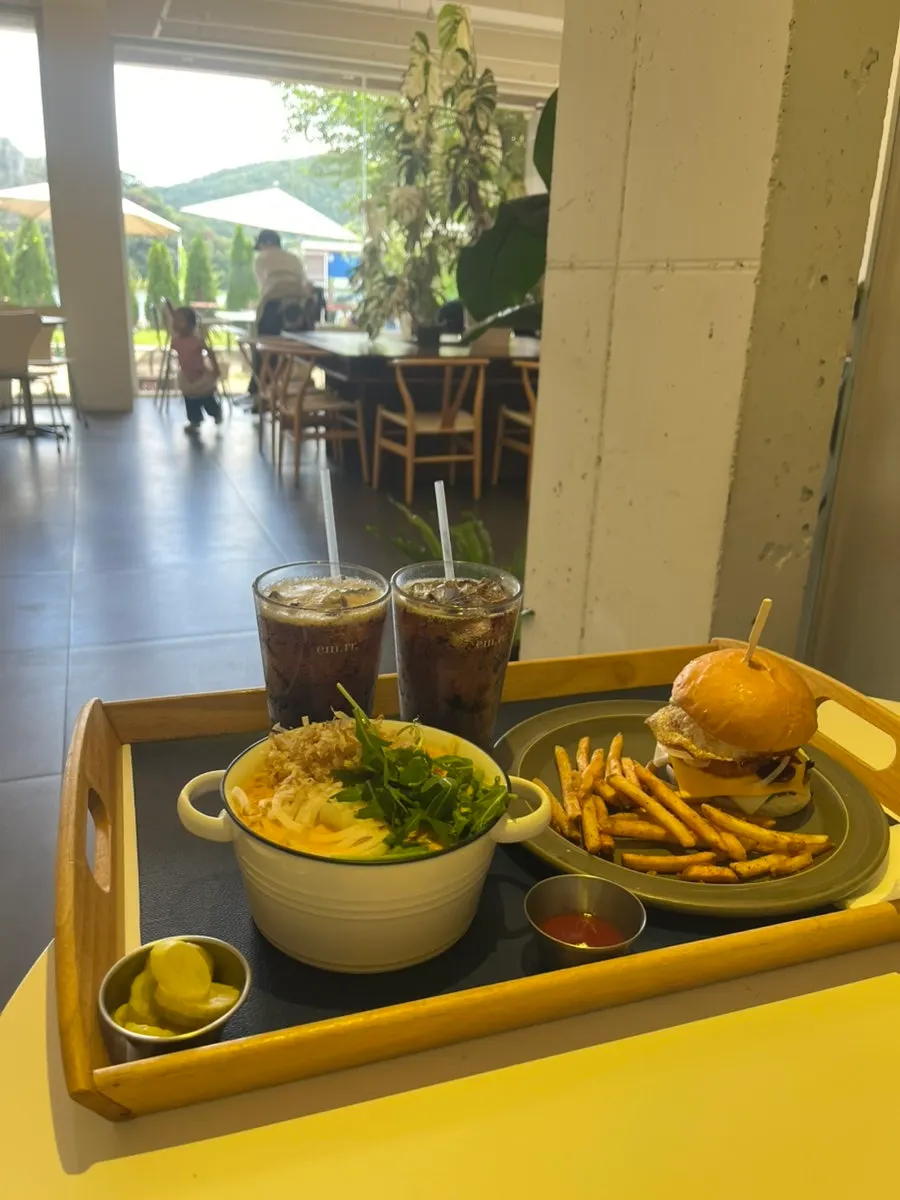 A full spread of spicy cream curry udon and a Mountain Burger