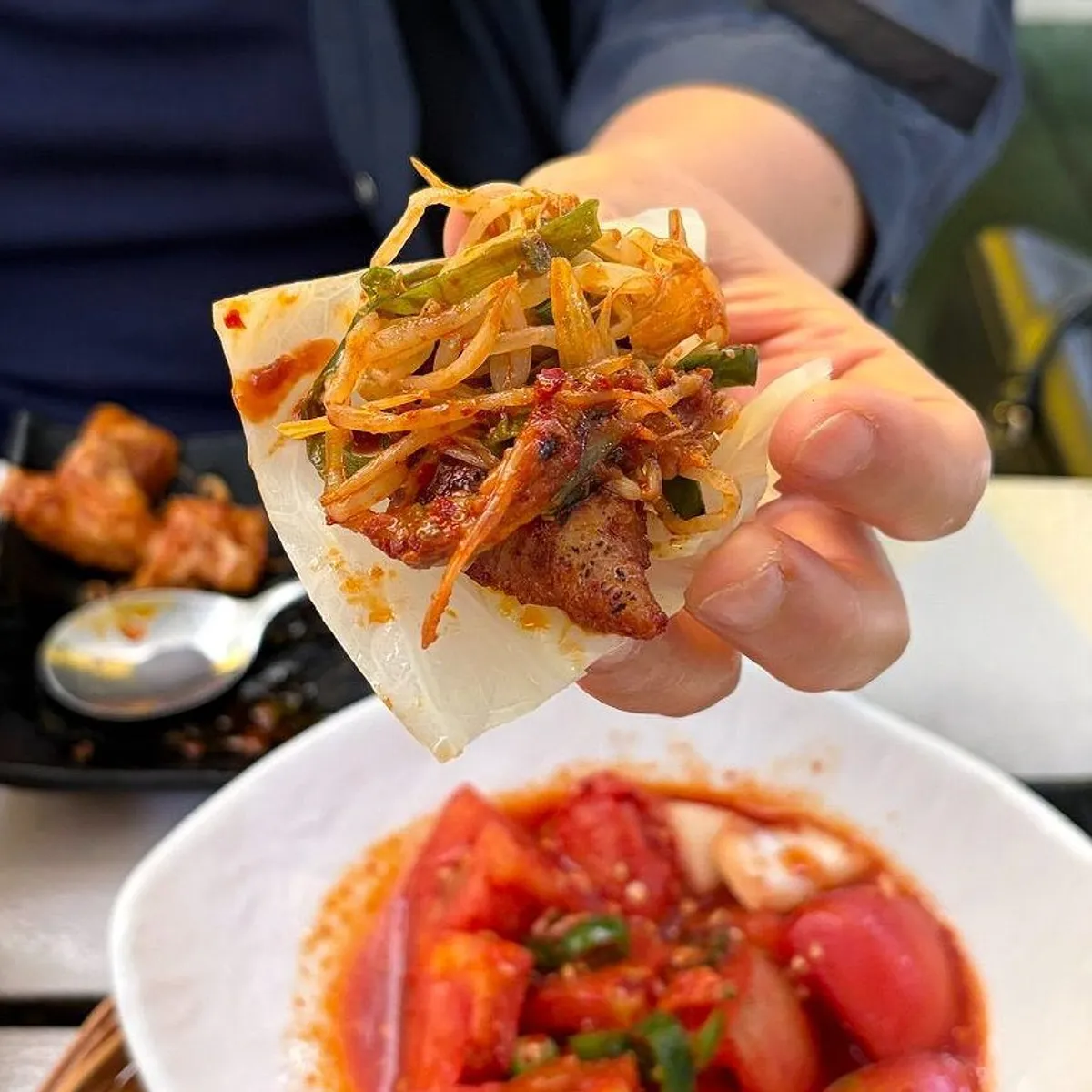 Tomato-jang pork belly served with cheese