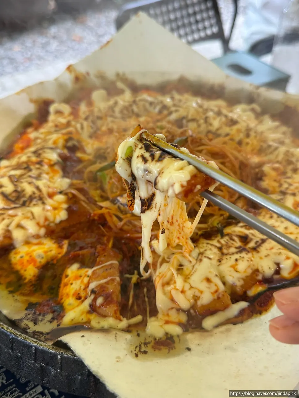 Pork belly wrapped in a rice cracker with bean sprouts