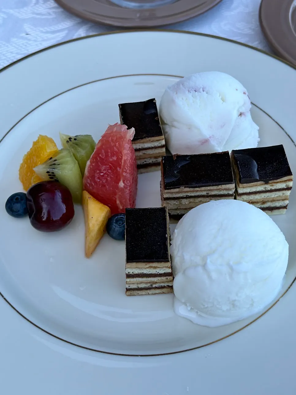 Ice cream platter with tiramisu and seasonal fruit