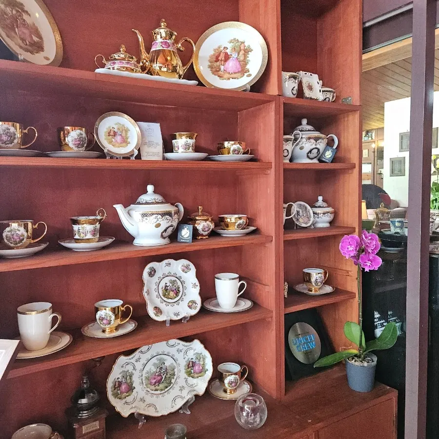 Café interior displaying elegant teacups