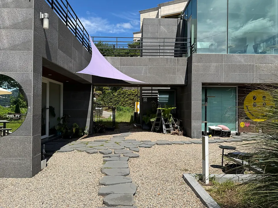 Modern building exterior with outdoor terrace seating