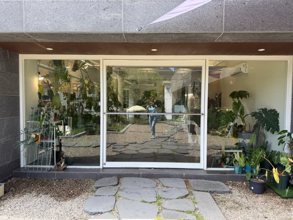 Large glass door entrance leading inside