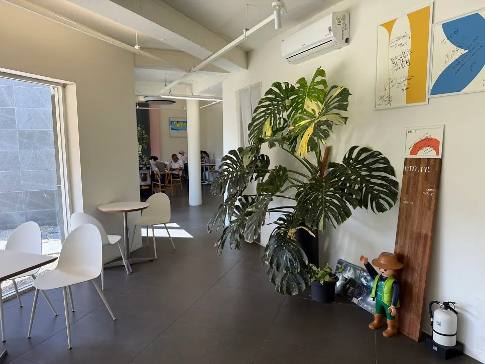 Café interior seating with wide table spacing