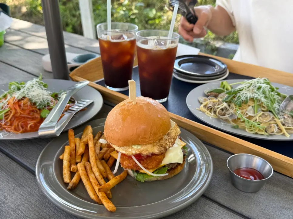 Brunch spread and americano set on an outdoor table