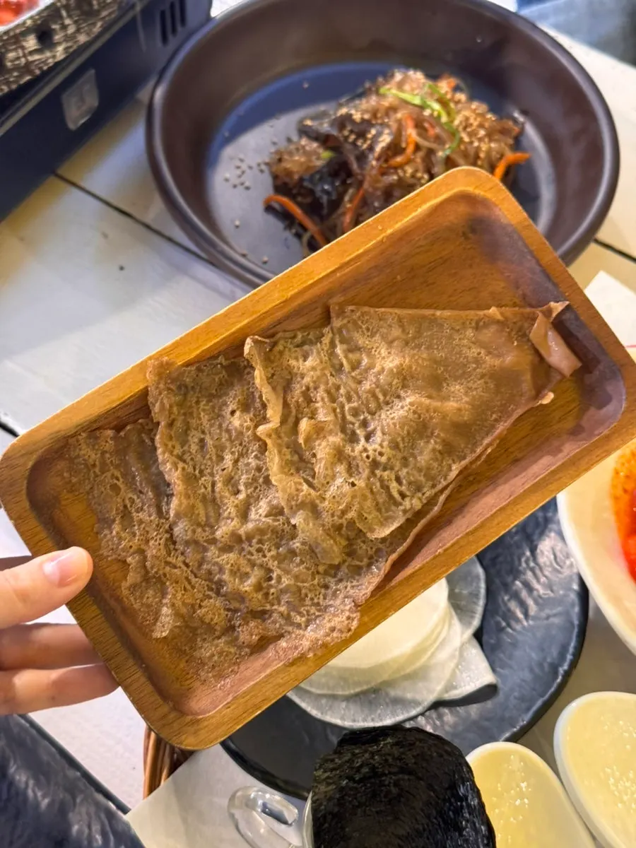 Warm japchae side dish served at the table