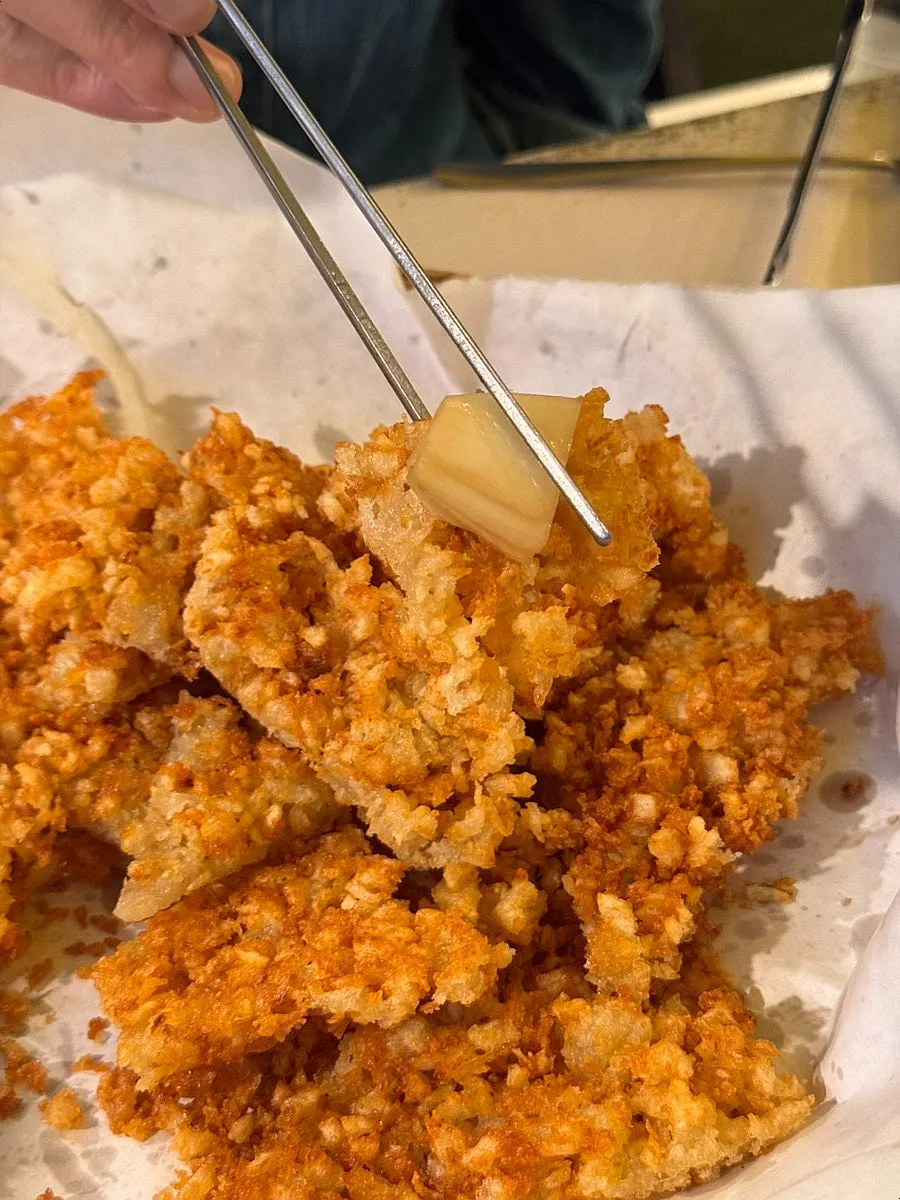 Picking up a piece of the potato pancake