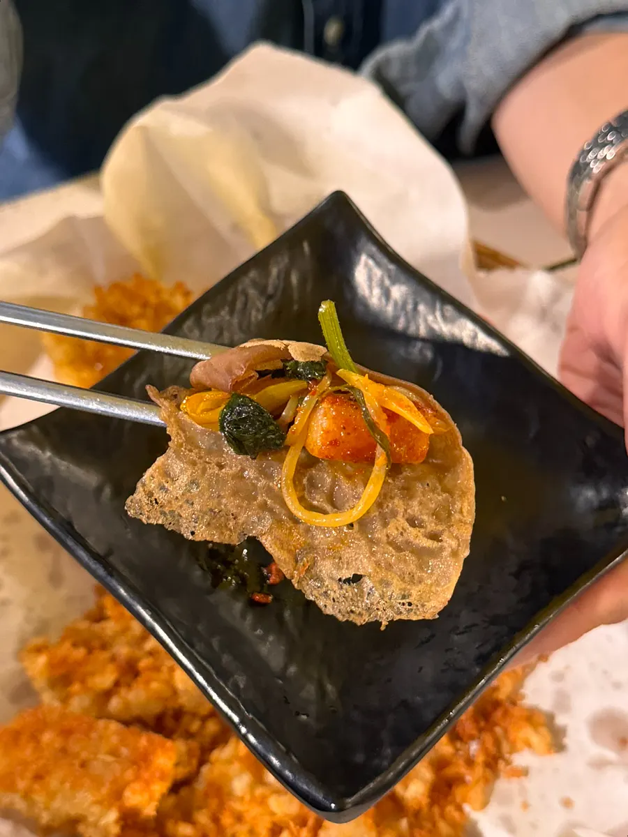 Wrapping pork belly and scallion strips in jeonbyeong