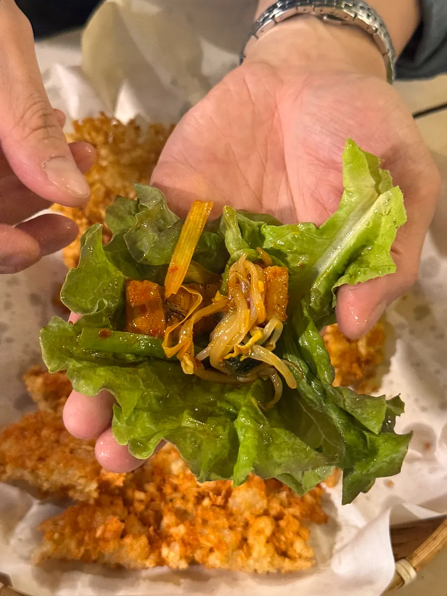 A bite assembled with the gim and pickled radish combo