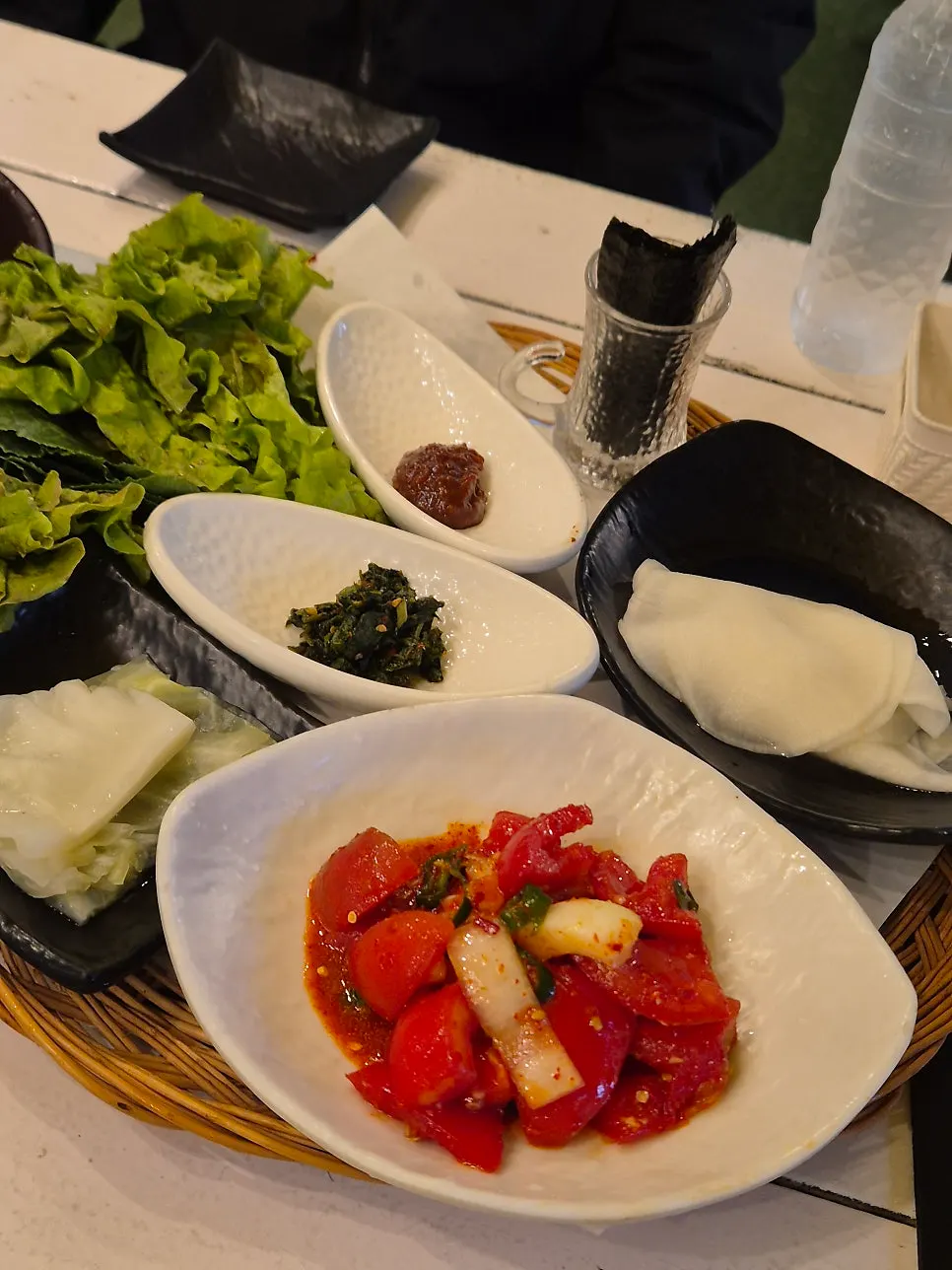Basic spread of side dishes and wrap greens