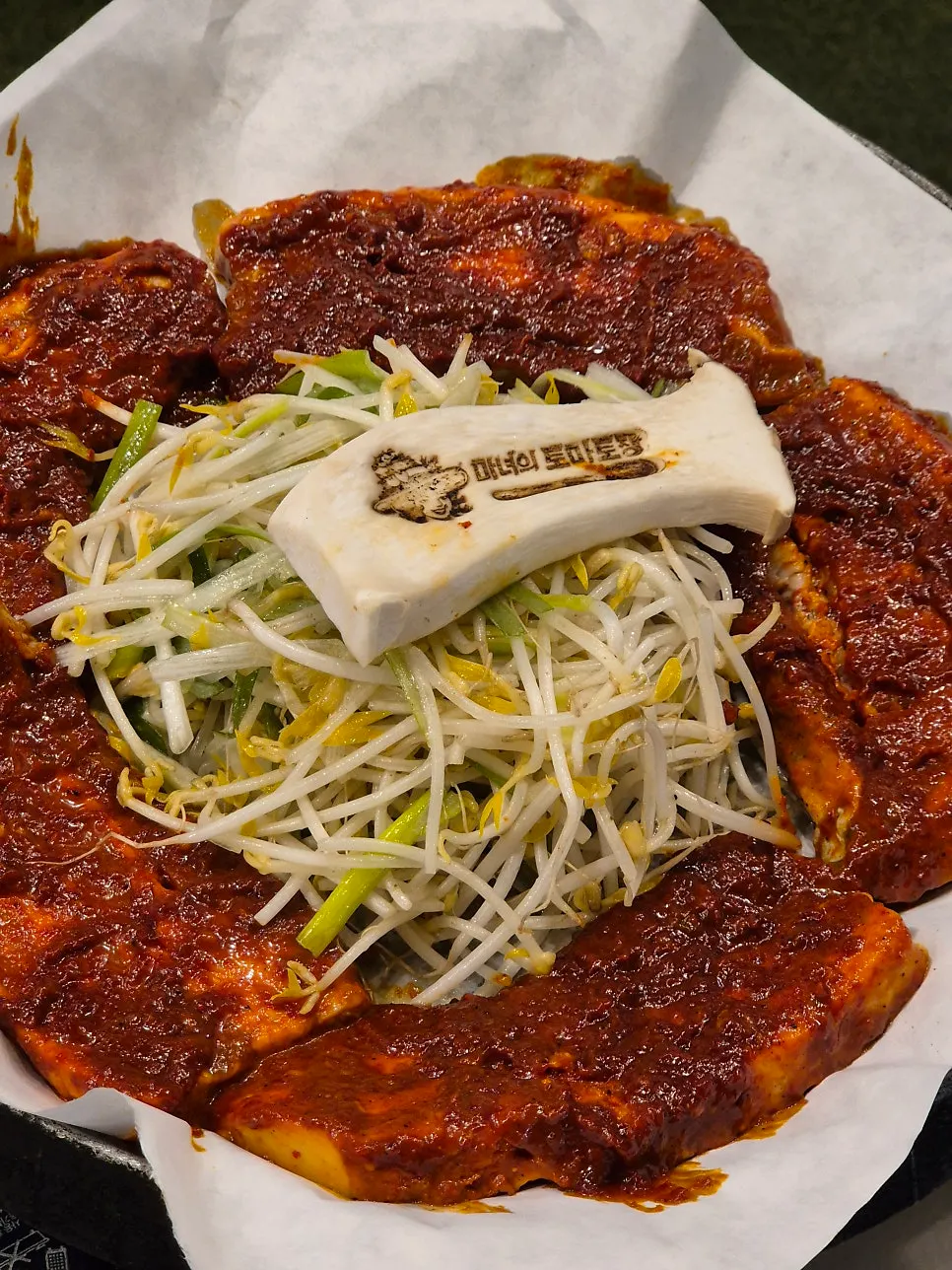 Close-up of the tomato-jang pork belly set on the grill