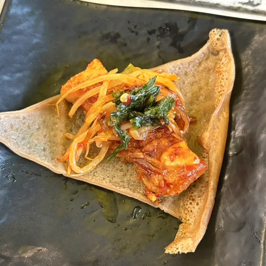 Tomato-jang pork belly wrapped in lettuce