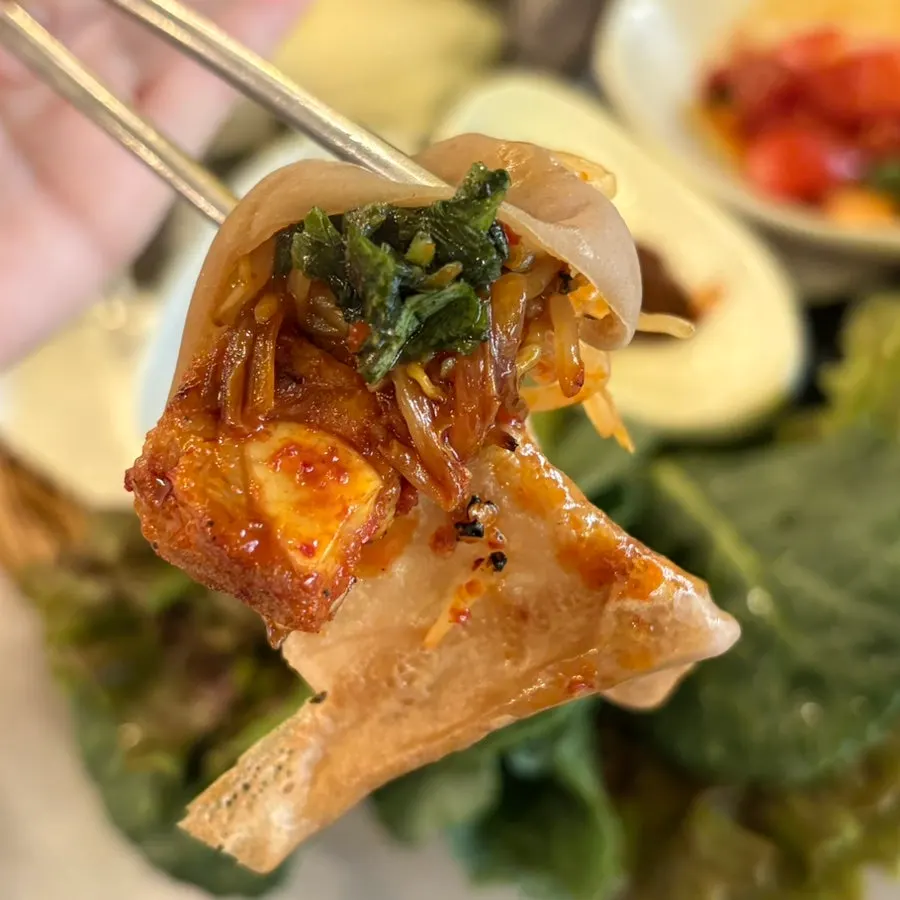 Pork belly served with tomato kimchi