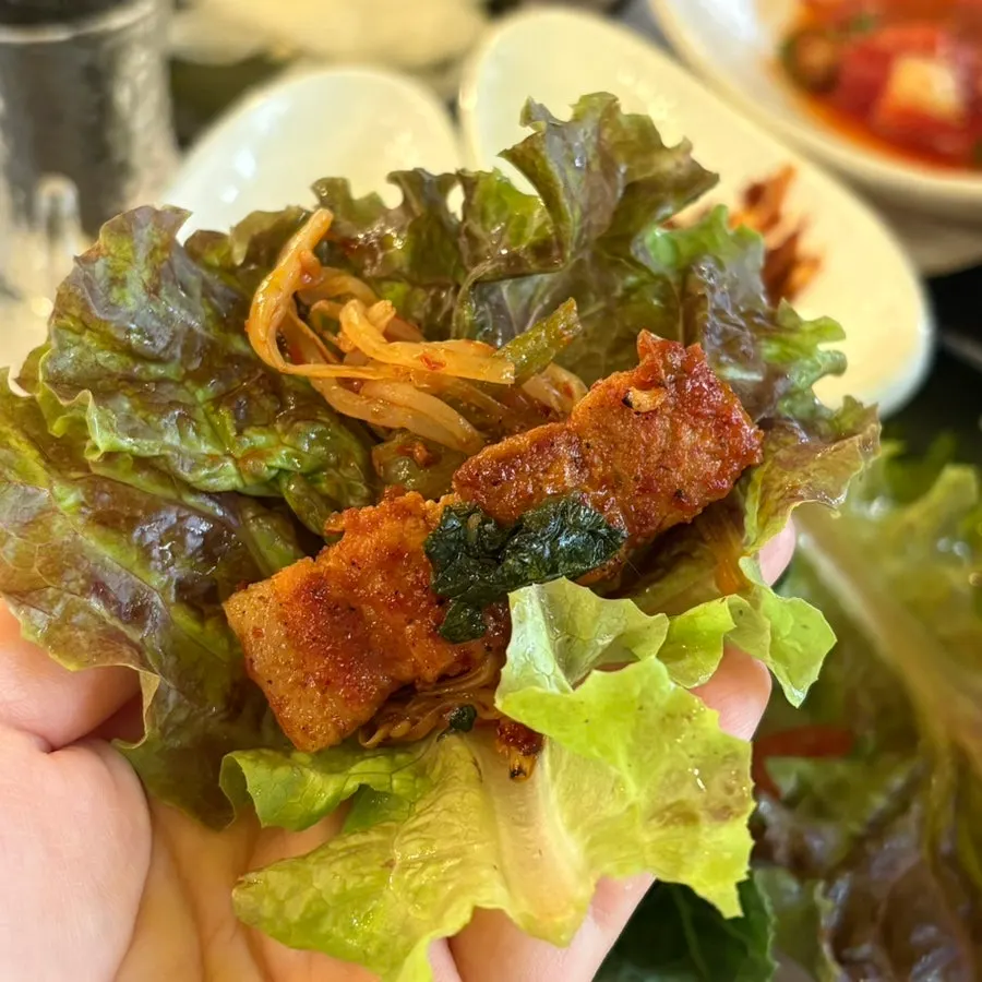 Nearly emptied grill of tomato-jang pork belly