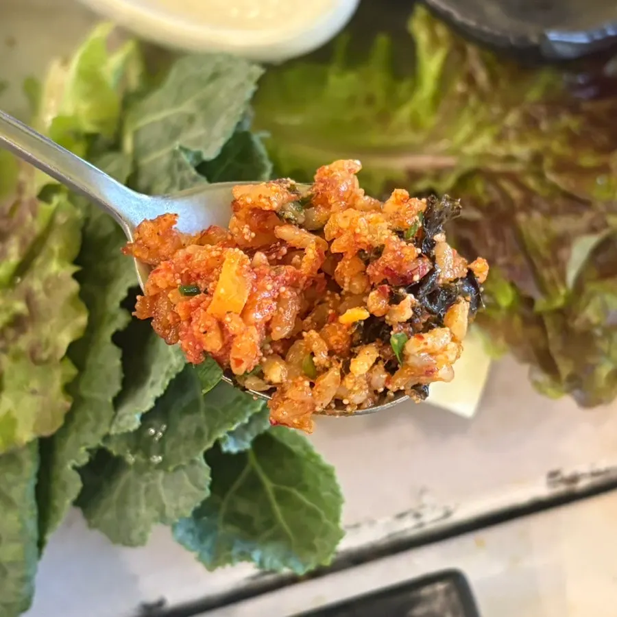 A spoonful of fried rice with pollock roe