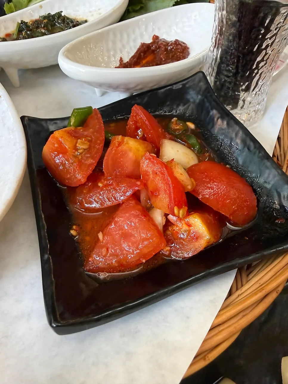 Tomato kimchi and side dishes for the meat