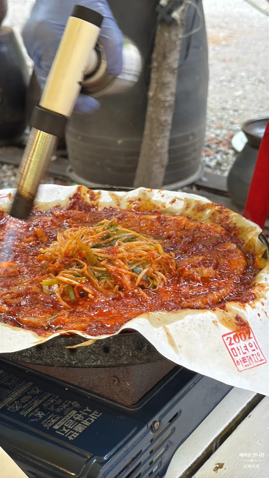 Close-up of jar-aged tomato sauce pork belly