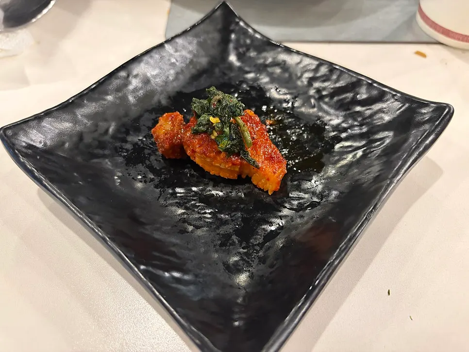 A piece of meat topped with perilla leaf oil-jang
