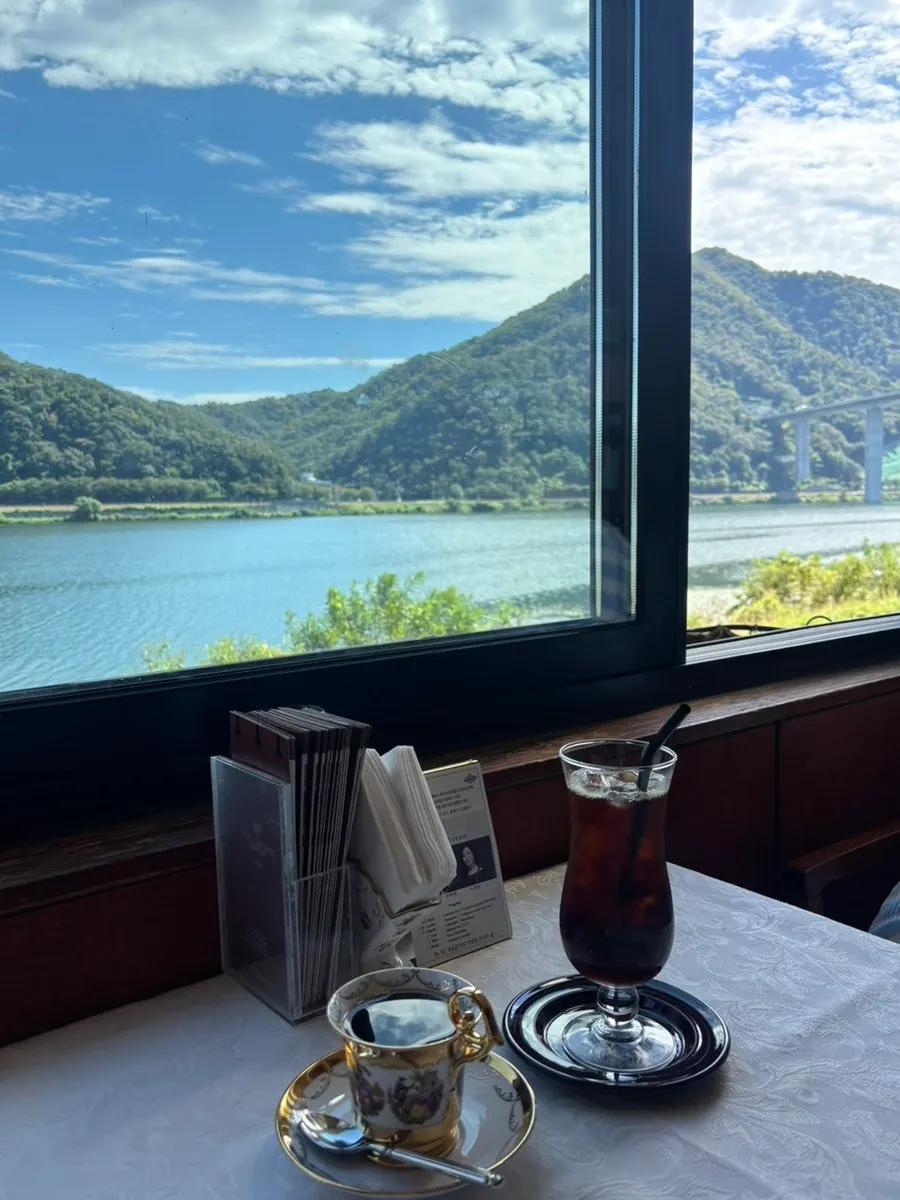 A cup of coffee set against the Bukhan River view