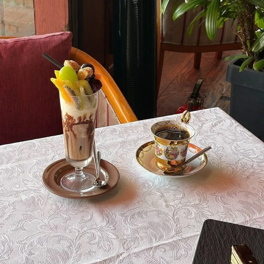 Table with Jamaica Blue Mountain hand drip, parfait, and opera cake